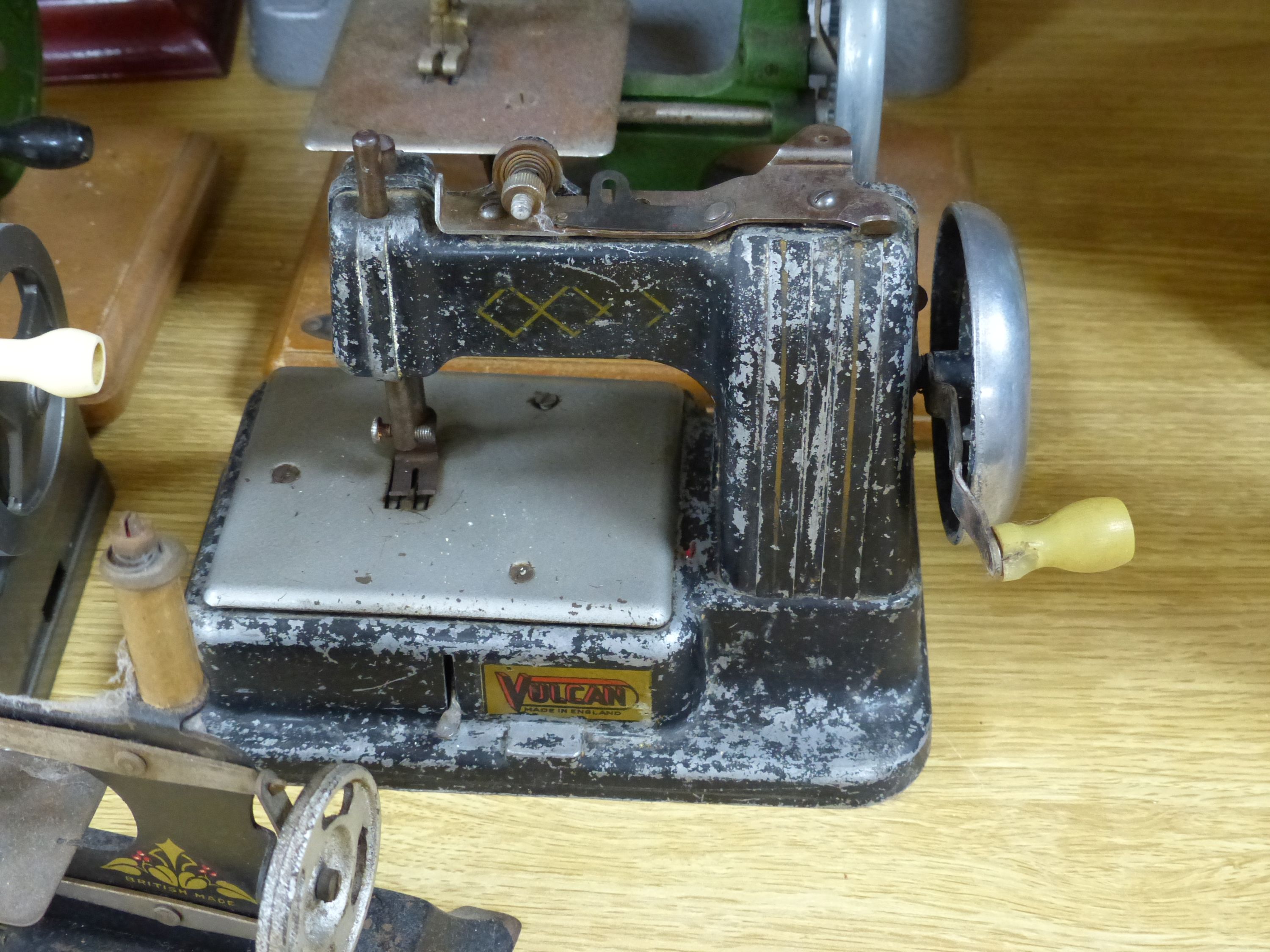 Six miniature sewing machines